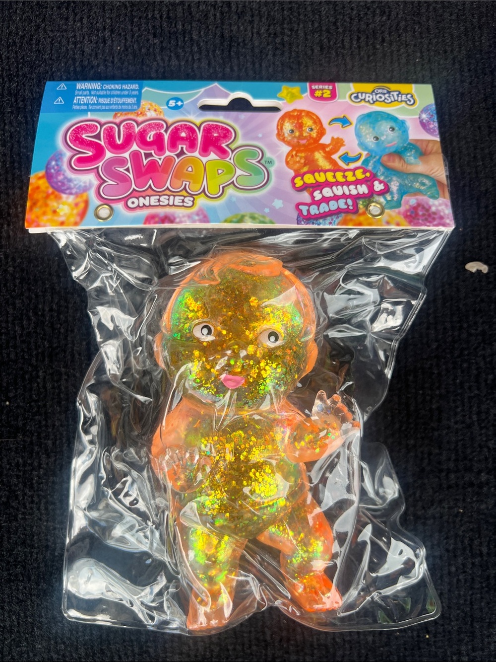 Onesies Orange Glitter Squeeze Toy